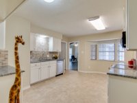 Welcome to your new kitchen!  New cabinet doors, new cabinets above cooking area, new light fixtures, new floors, new backsplash, new wall texture and paint.