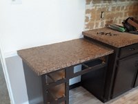 Here is where we move the fridge to.  We removed this unused desk to allow room for the new counter depth fridge.  Luckily the home owner had flooring material so I could patch the floor where the desk was removed.